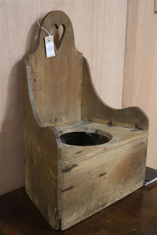 A childs Victorian pine commode chair W.43cm